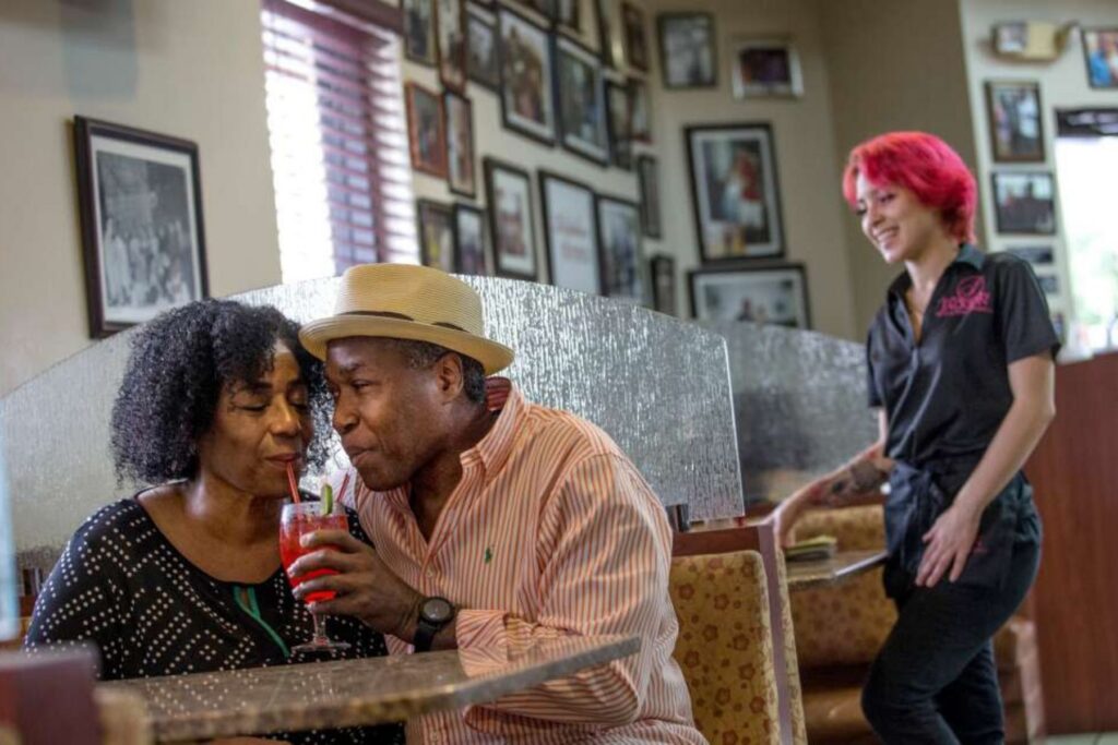 Couple exploring Overtown's historic art and cultural landmarks in Miami